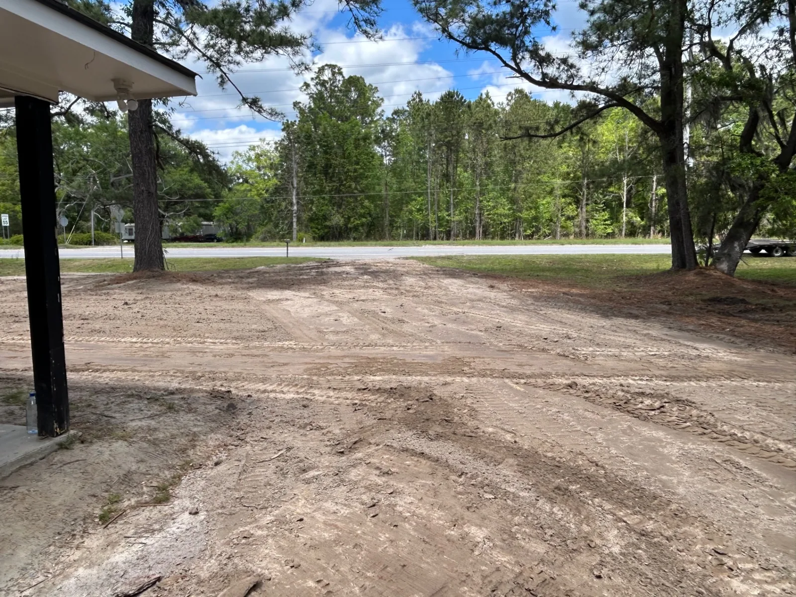 Cleared roadside lot with drive access cut in