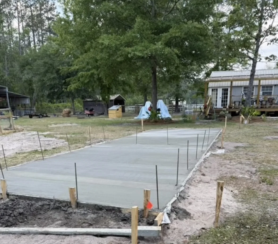 Concrete pad pour with rebar tie-ins